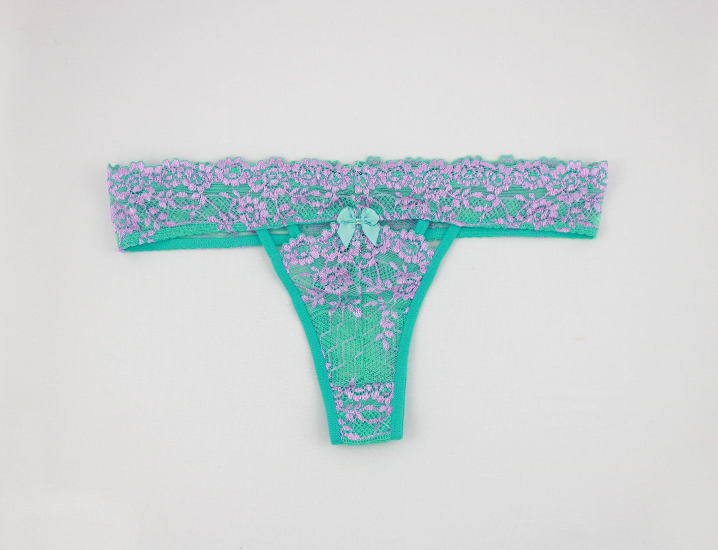 black and jade lace thongs with a cut out detailing